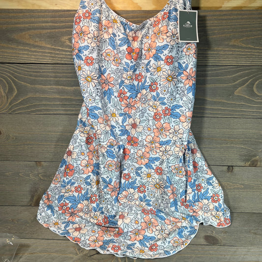 Floral swimdress with tummy control in XL, featuring pink and blue flower patterns on a wooden background.