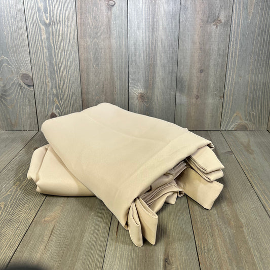 Beige RYB HOME outdoor curtains folded, showcasing waterproof blackout fabric ideal for patio privacy and sun protection.