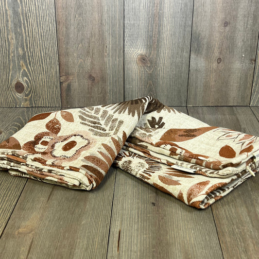 Sunflower-patterned throw pillow covers in brown and cream, 22x22 inches, perfect for sofa or bed decor.