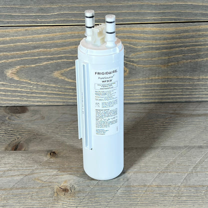 Frigidaire WF3CB PureSource3 water filter cartridge on wooden surface, showcasing dual connectors and detailed label.