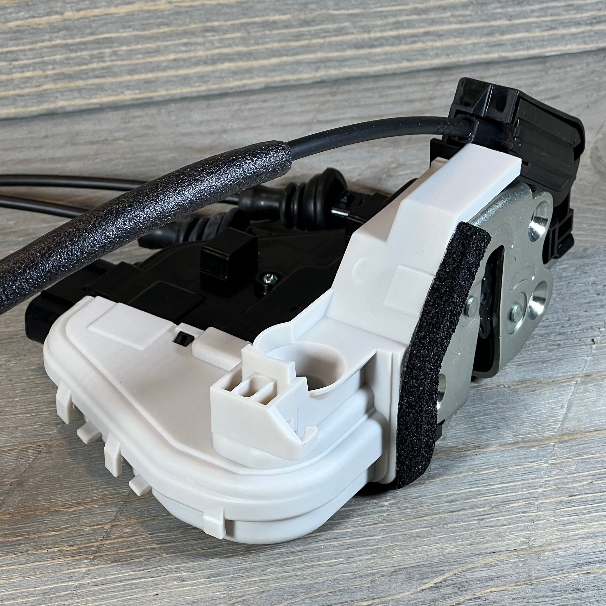 Front view of door lock actuator and latch assembly for 13-19 Hyundai Santa Fe, passenger side, OEM 81320-2W010 replacement.