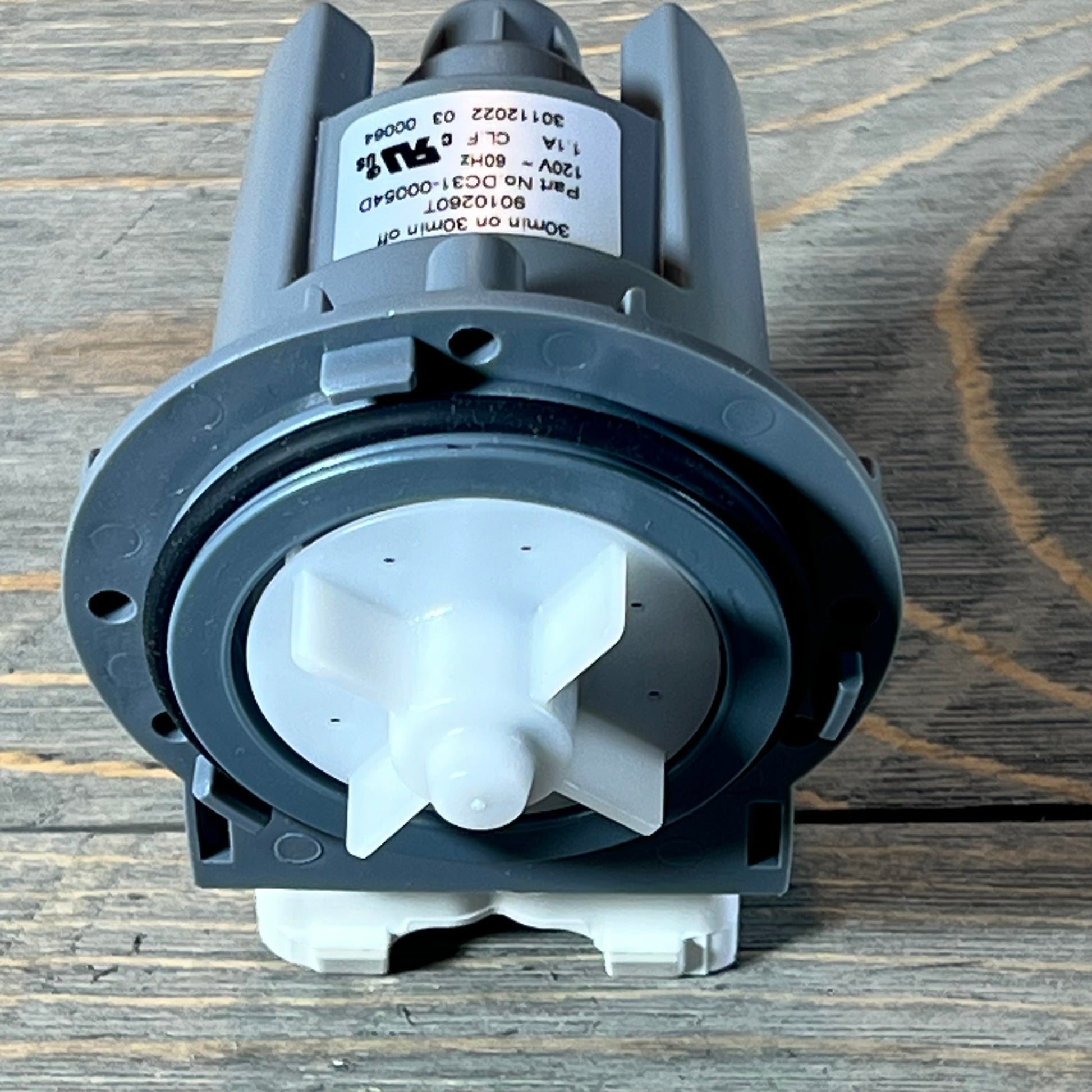 Front view of Supco LP054D washer drain pump, gray and white design for Samsung replacement.