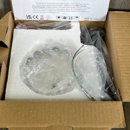Yosoan Boho wall sconce in packaging, featuring a transparent tulip flower shade, ideal for modern home decor.