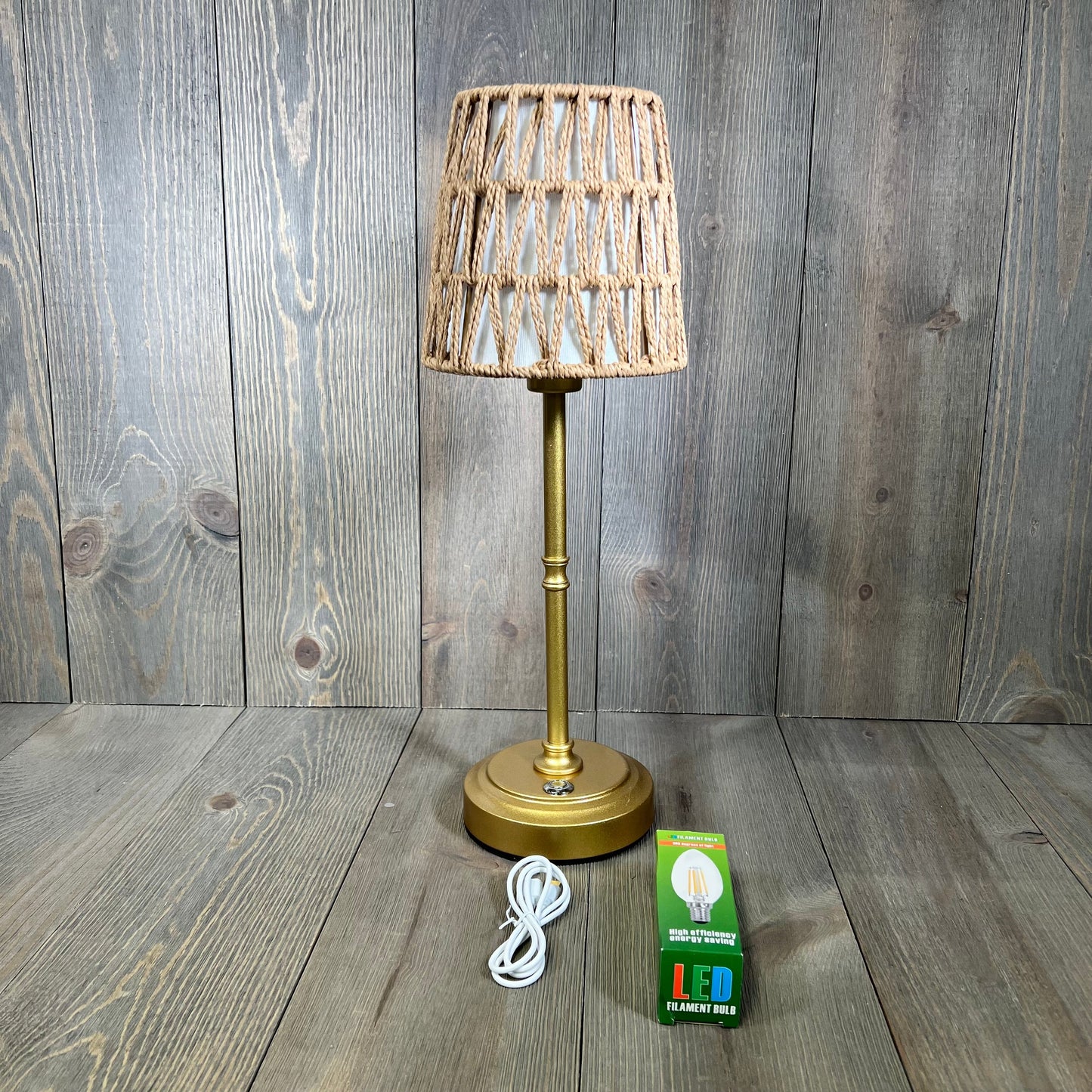 Gold rechargeable rattan cordless table lamp with stepless dimming and E12 bulb, perfect for bedside or nursery.