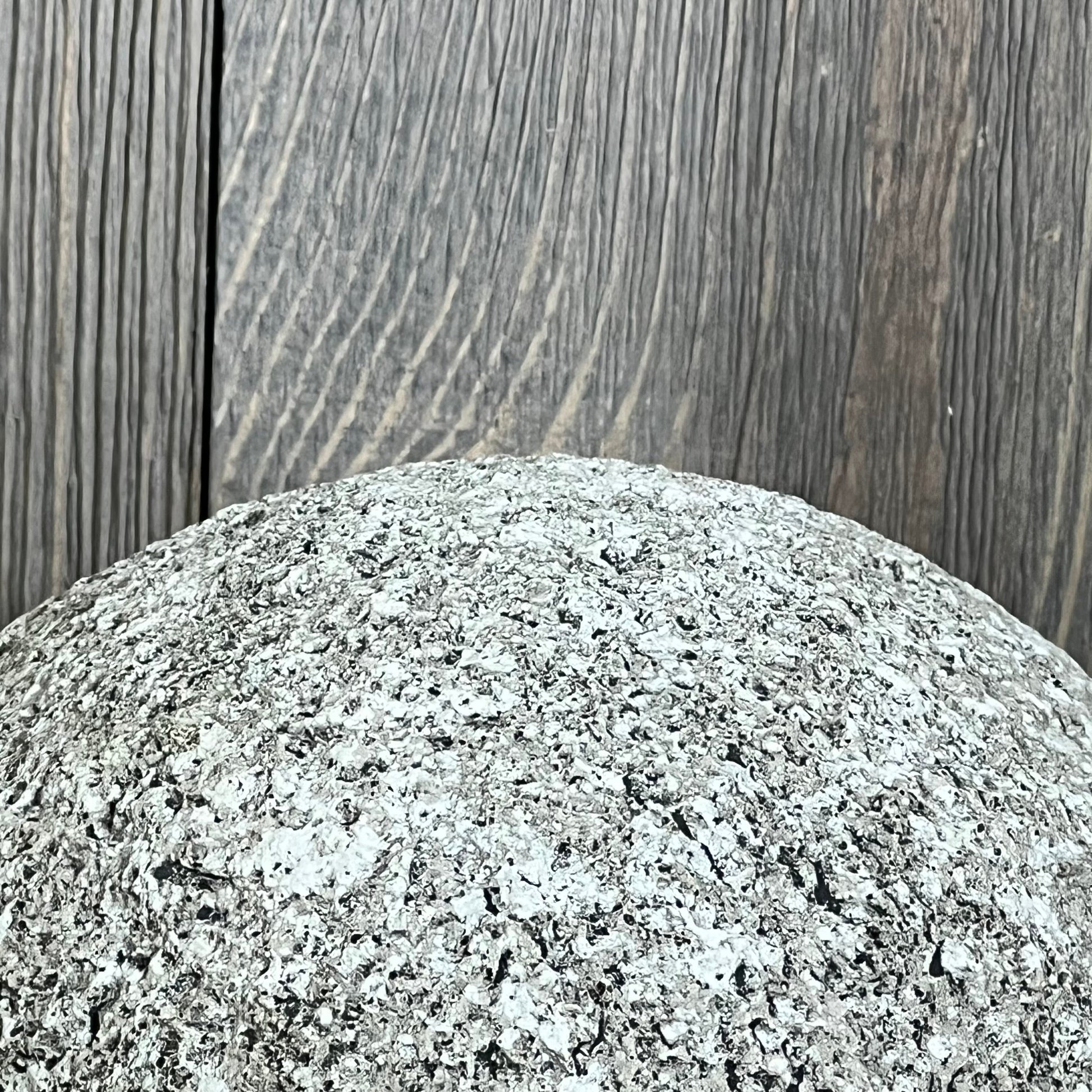 Modern gray polyresin sculpture with textured surface, ideal for contemporary home decor and artistic displays.