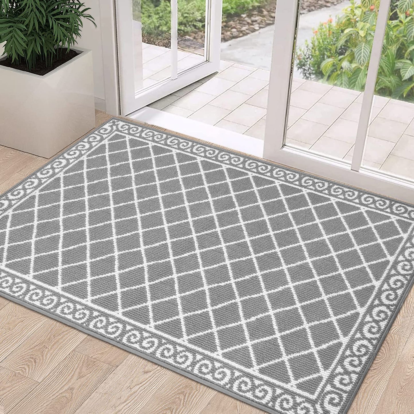 Gray HEBE indoor door mat with non-slip backing, perfect for entryways, washable and low-profile design for easy cleaning.