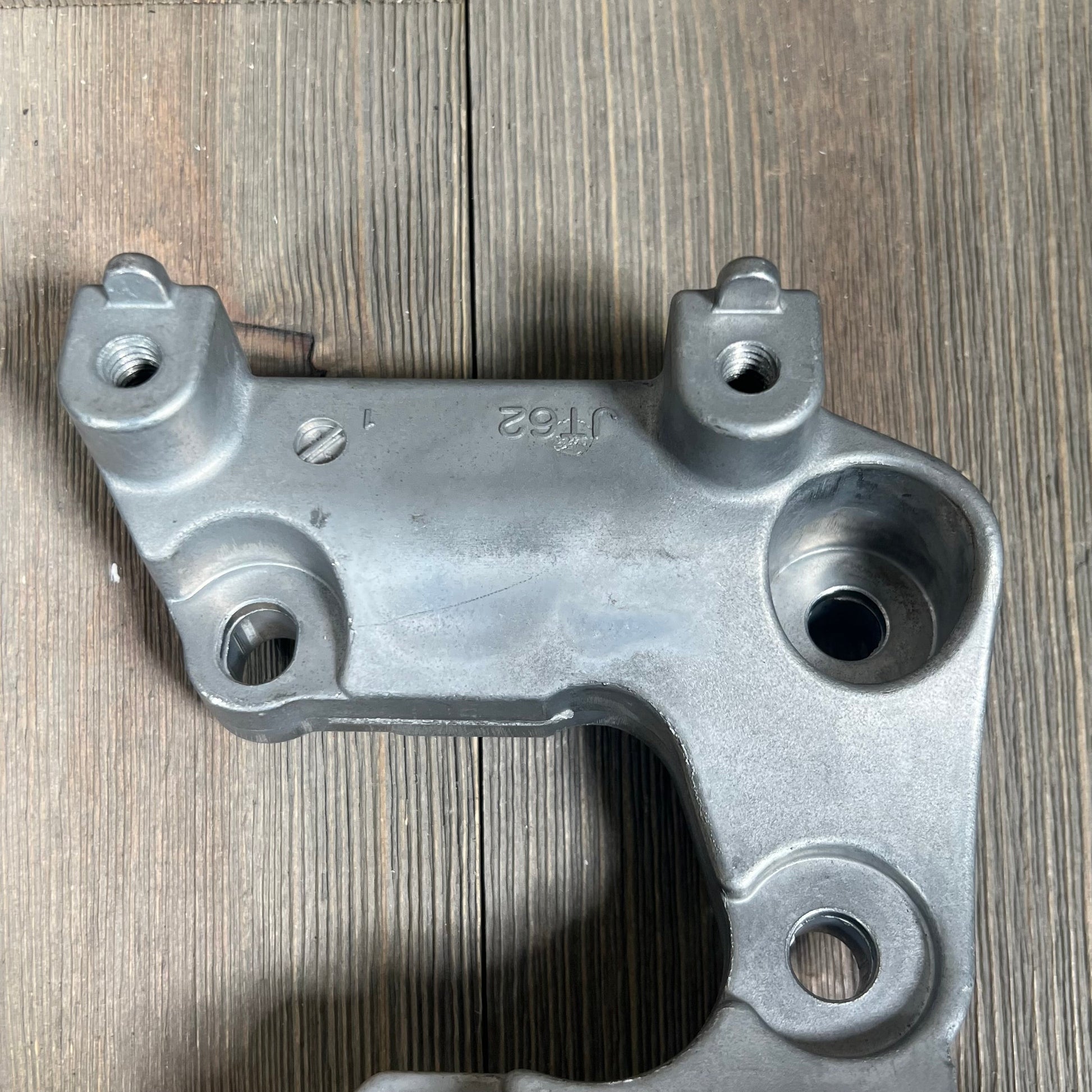 Toyota Lexus 3.5L 4.0L V6 drive belt tensioner assembly, part number 16620-31040, on wooden surface.