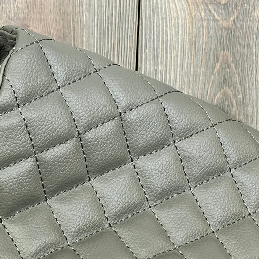 Quilted gray leather armrest cover for Ford F250-F450, featuring durable stitching and sleek design.