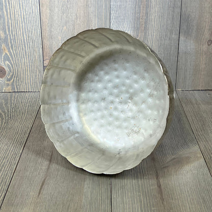 Distressed champagne metal compote bowl with a textured finish, perfect for indoor and outdoor event decor.