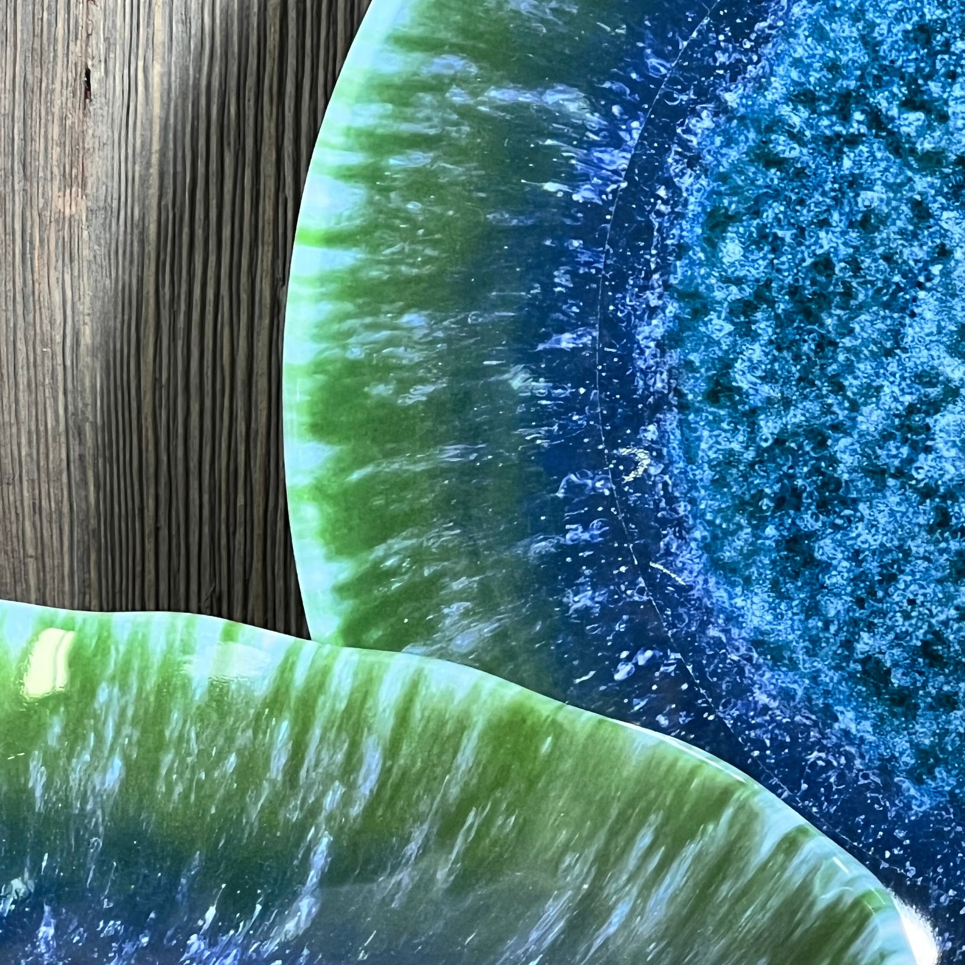 Turquoise teal melamine pasta bowls with a vibrant, textured design on a wooden surface, ideal for salads and soups.