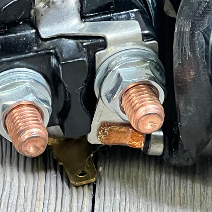 Close-up of OCPTY Starter terminal connections for Grand Cherokee 4.0L L6, showcasing copper and metal components.