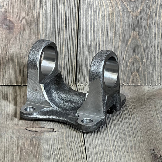 Flange yoke 37315-35040 for Toyota 4Runner on wooden surface, fits Celica, Land Cruiser, Tacoma, compatible with 5-1510X U-Joint.