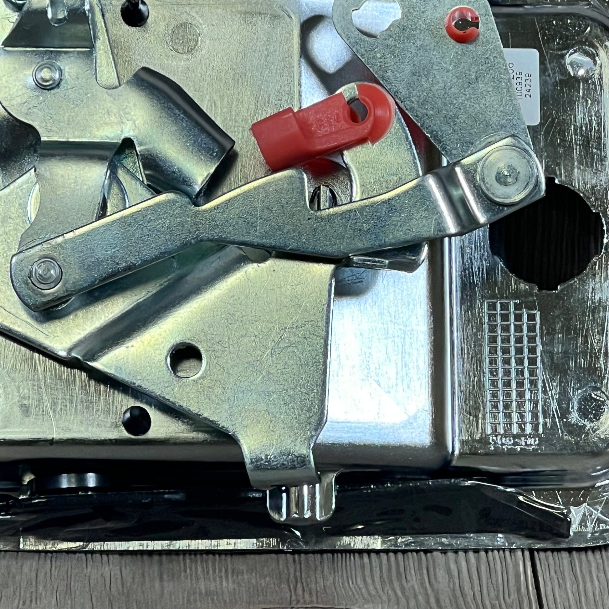 Chrome exterior door handle for Freightliner, featuring robust metal construction and white hardware, close-up view.