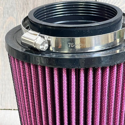High-performance engine air filter kit for Yamaha YFM700 Raptor, featuring a silver intake and holder adapter.