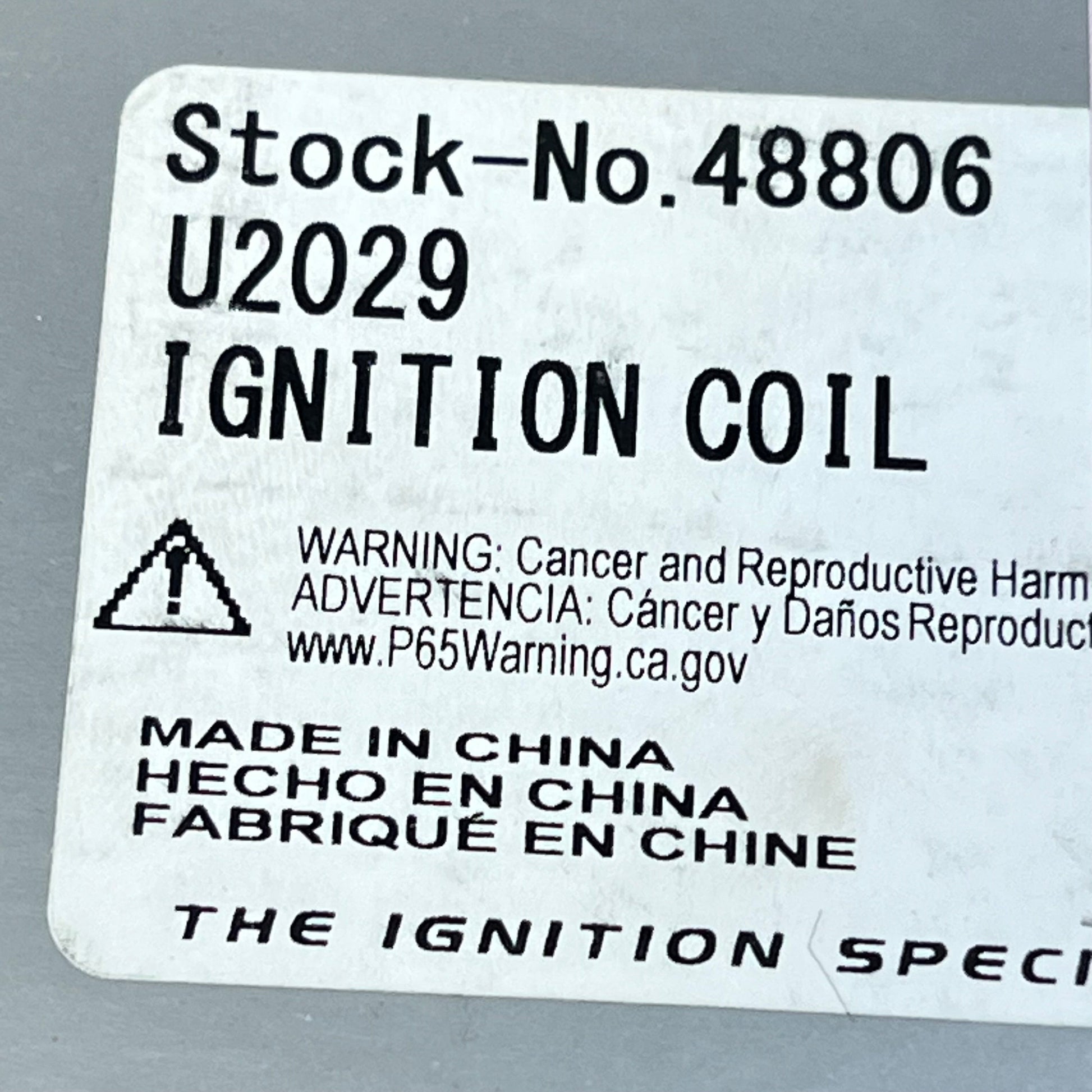 Ignition Coil U2029 label showing stock number 48806 with safety warning, ideal for distributorless ignition systems.