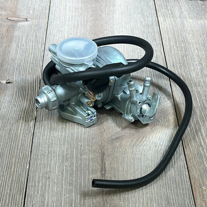 Carburetor replacement for Honda TRX 90EX, showcasing durable metal build and fuel hose, compatible with 1993-2006 models.