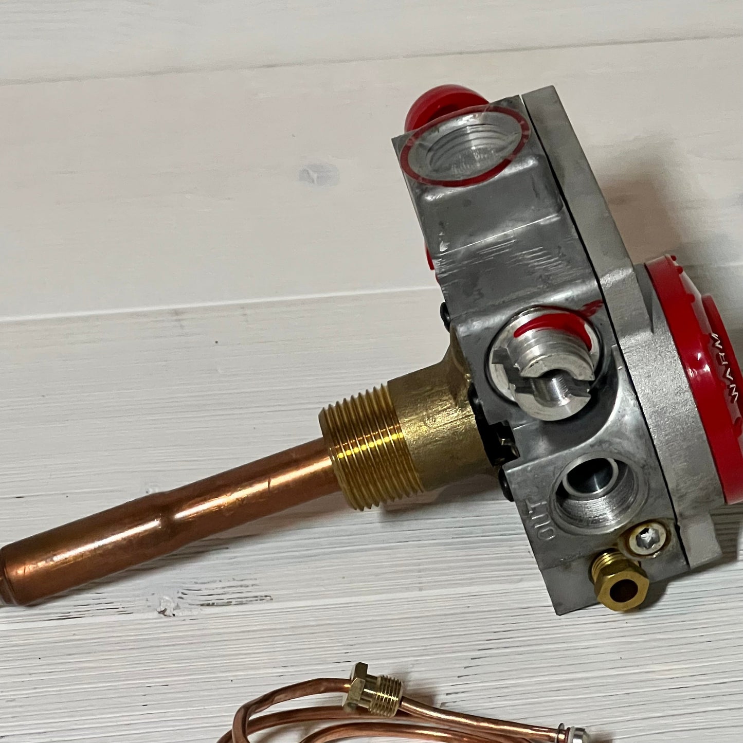 Natural gas water heater valve with 1-3/8" shank and 3-1/2" W.C, featuring a copper and brass design for durability.
