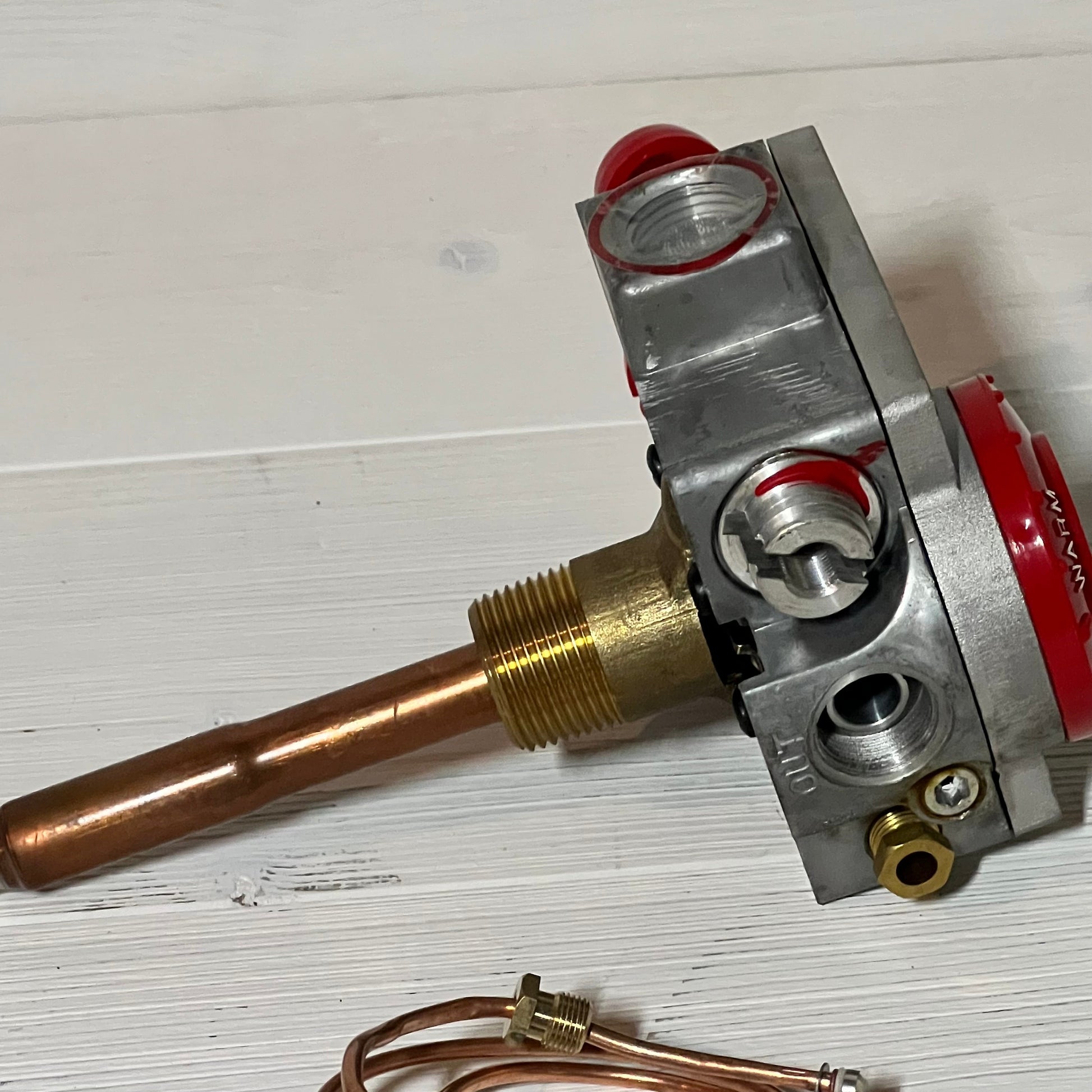 Natural gas water heater valve with 1-3/8" shank and 3-1/2" W.C, featuring a copper and brass design for durability.