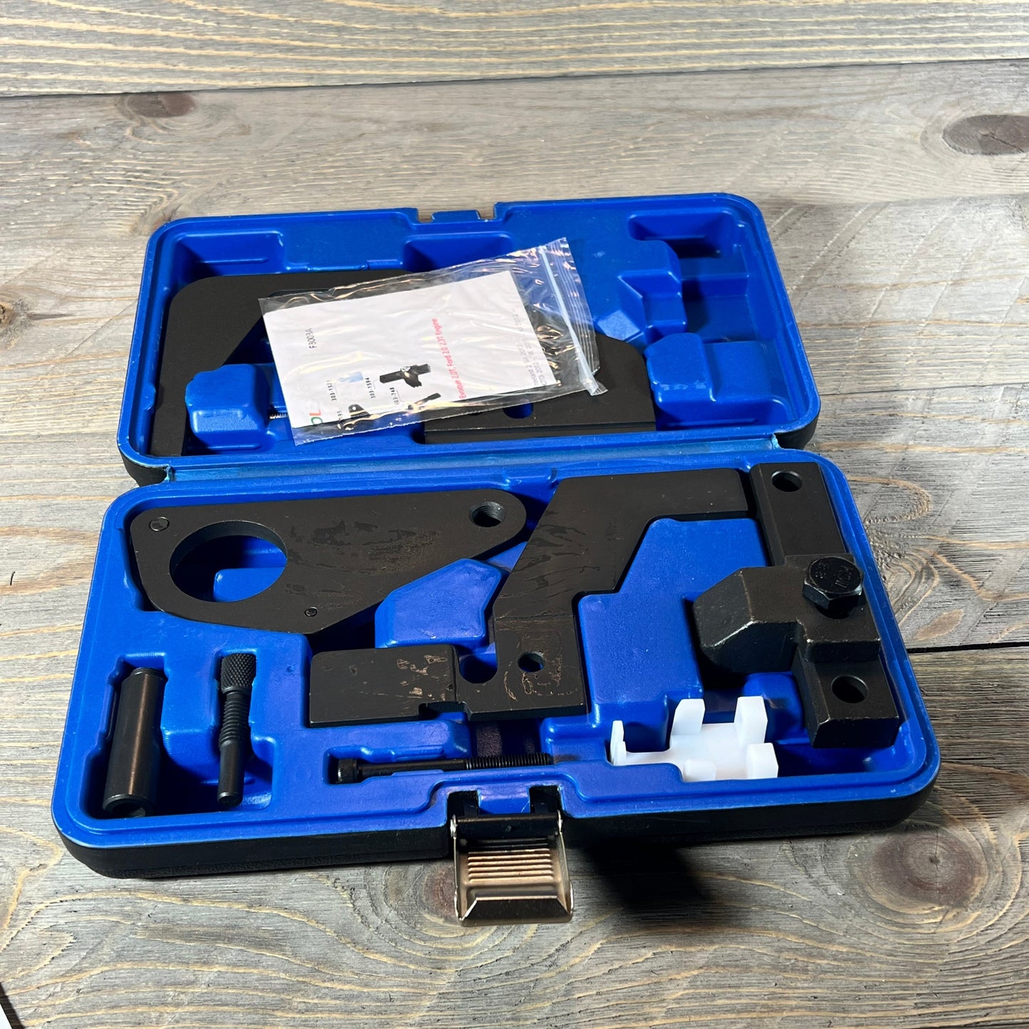 Blue DPTOOL camshaft timing lock tool set for Ford/Jaguar engines, neatly organized in a protective case.