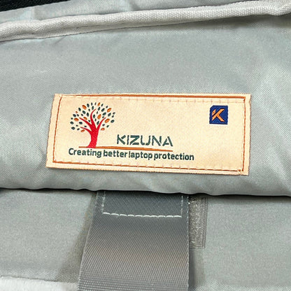 KIZUNA laptop bag interior label showing quality stitching and brand logo for 17-inch laptop protection.