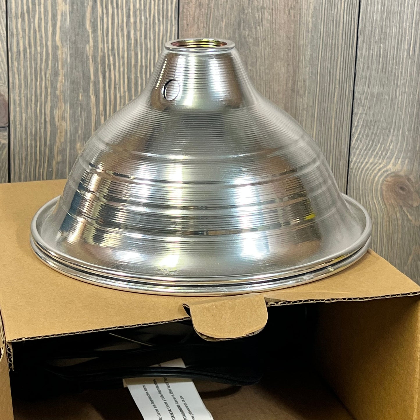 Silver aluminum reflector for Simple Deluxe Clamp Lamp, showcasing durable build and sleek design, fits up to 150W E26 socket.