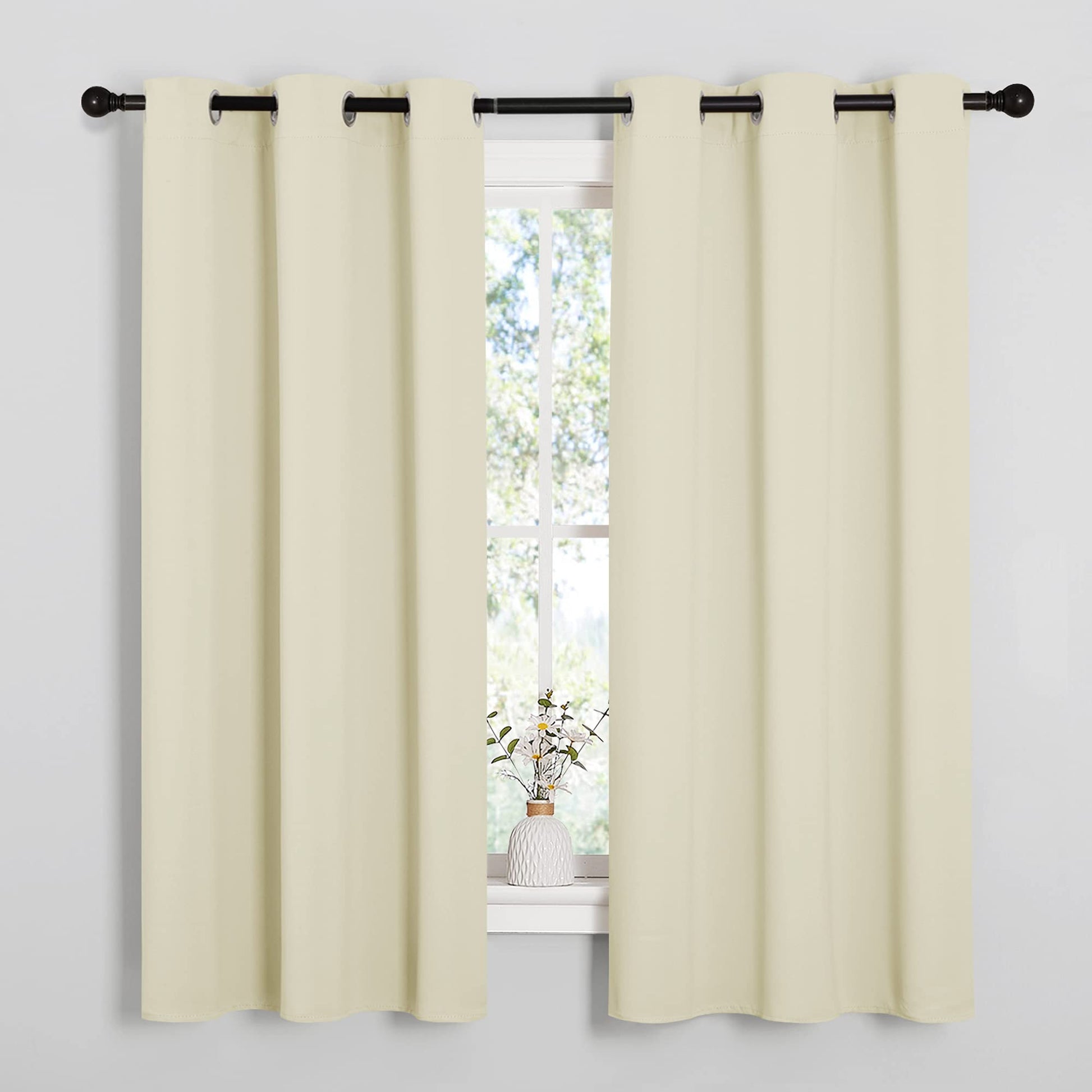 Beige NICETOWN kitchen curtains on window, thermal insulated and room darkening; ideal for laundry decor, 42x63 inches.
