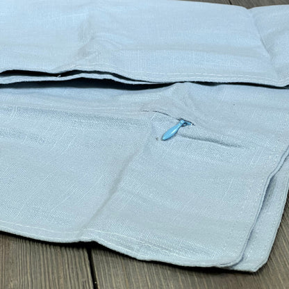 Light blue linen pillow cover with zipper, enhancing boho farmhouse decor for sofa or bed, 18x18 inch size.