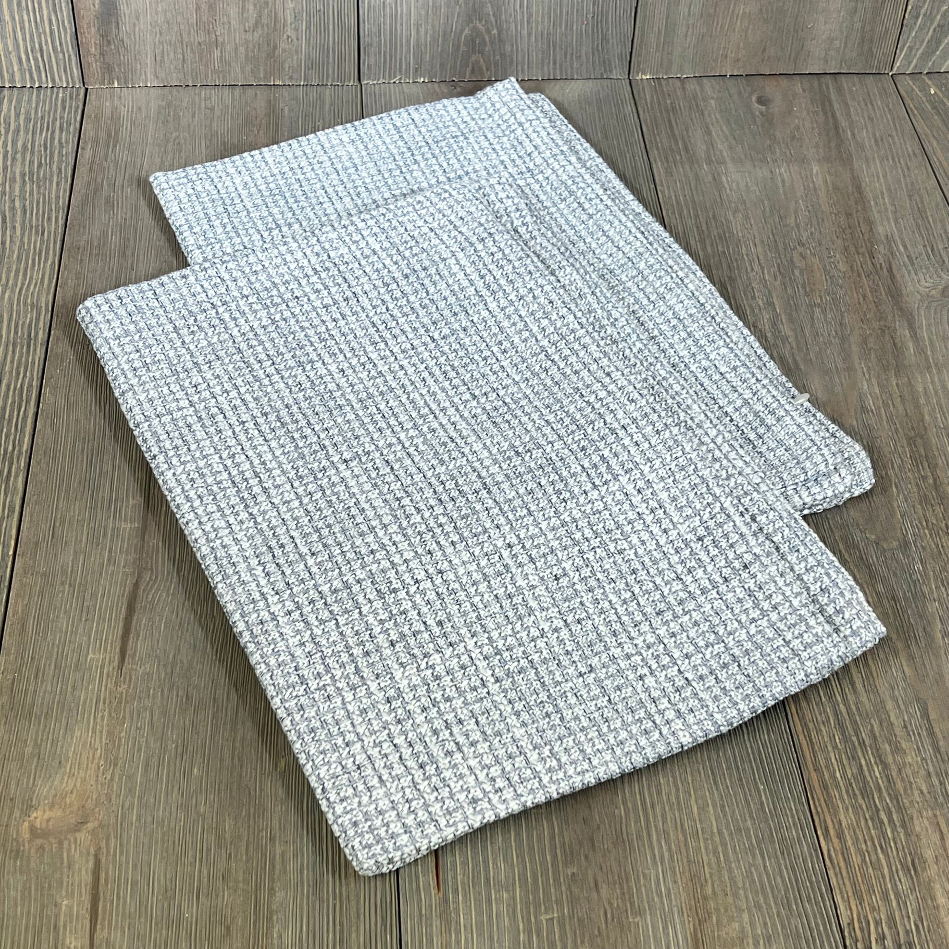 Blue grey linen pillow covers on wooden surface, perfect for farmhouse decor. Set of 2, 16x24 inch lumbar cushion cases.