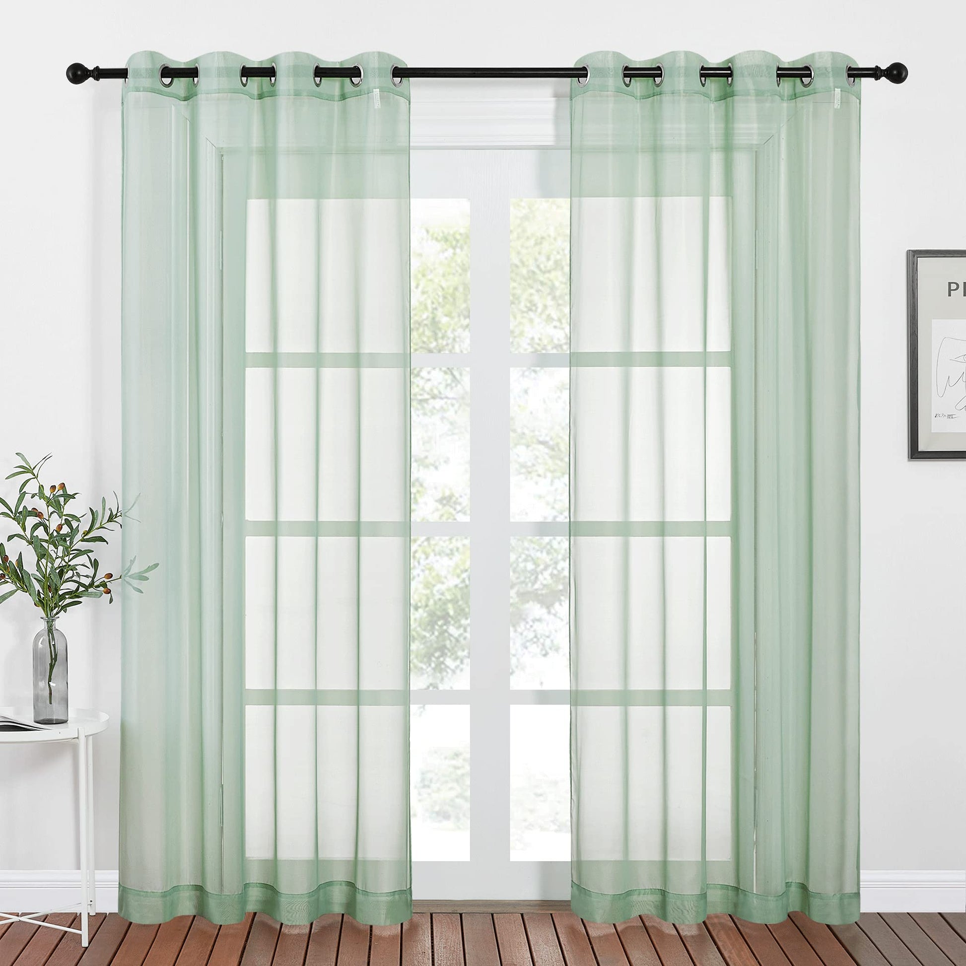 Sheer sage green curtains with ring top design, perfect for farmhouse-style living rooms or bedrooms, measuring W54 x L84.
