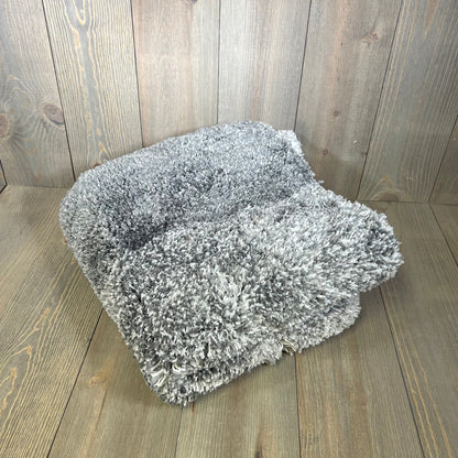 Soft grey OLANLY bathroom rug mat on wood floor, plush microfiber design, perfect for tub and shower areas.