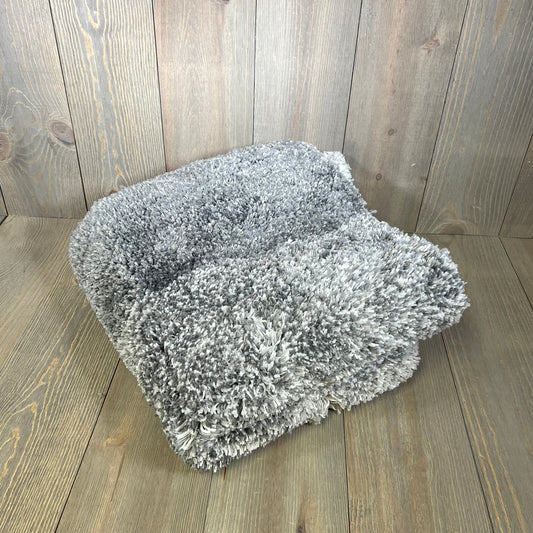Soft grey OLANLY bathroom rug mat on wood floor, plush microfiber design, perfect for tub and shower areas.