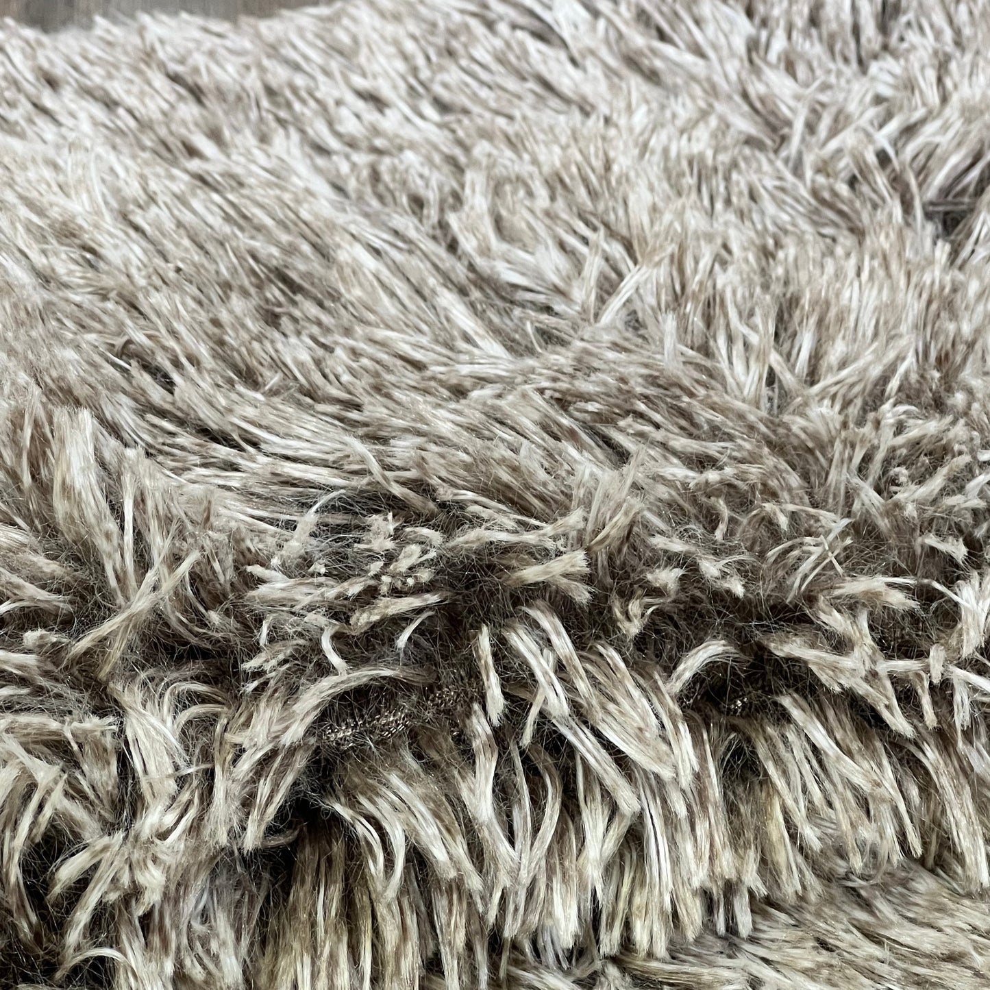 Shaggy ombre khaki faux fur pillow sham, showcasing luxurious texture and softness, perfect for home decor.