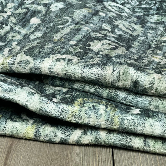 Vintage floral runner in dark green, folded, showcasing soft faux wool texture for entryway or kitchen.