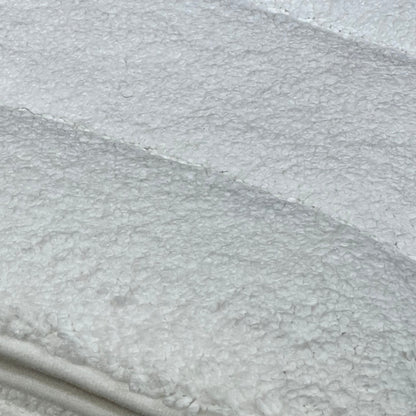 Close-up of DEXI bathroom rug texture, showcasing soft, absorbent microfiber surface, ideal for quick drying and comfort.