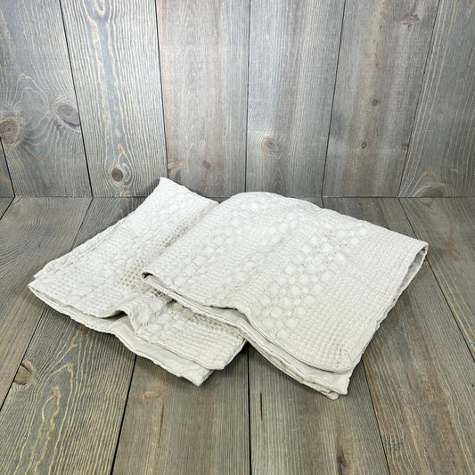 Cotton waffle weave Euro sham covers in oatmeal, showcasing luxury and soft texture for elegant home decor.
