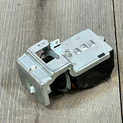 Durable headlight switch for Dodge Ram 1500/2500/3500 1998, showcasing robust metal construction on wooden background.
