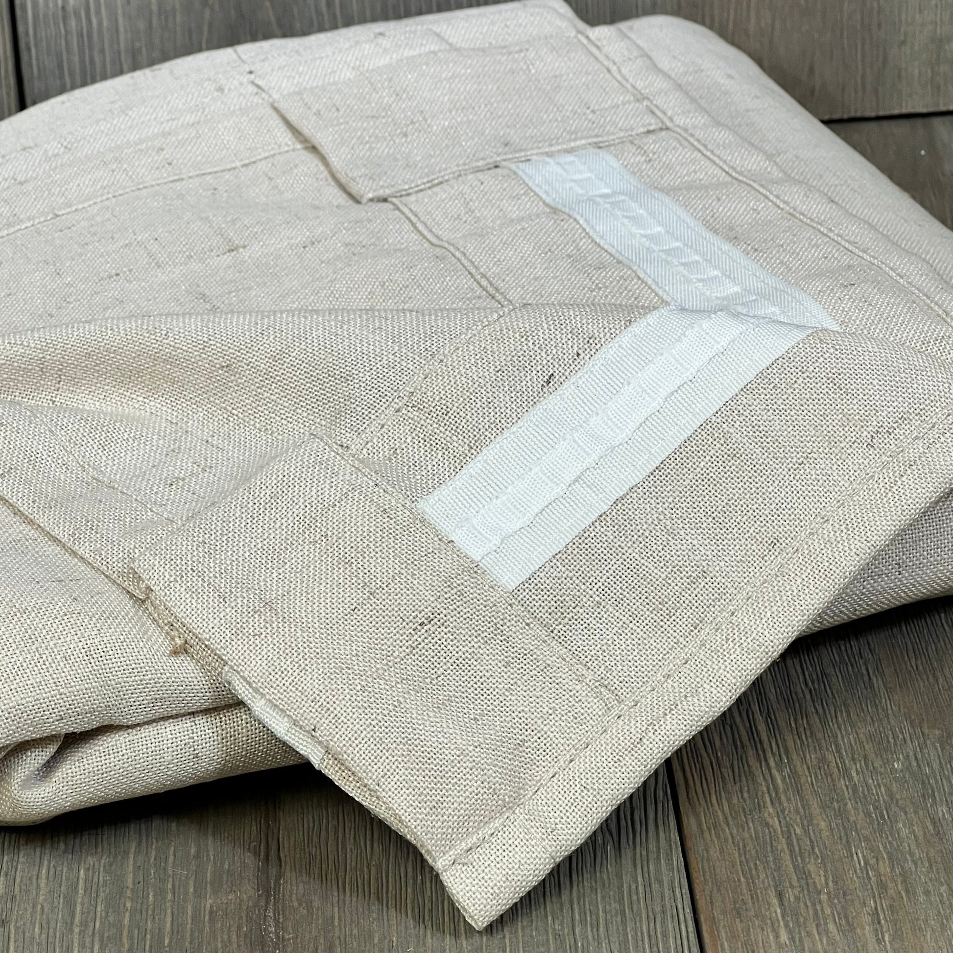 Linen curtains with rod pocket and back tab design, offering a soft, thick texture for light filtering in farmhouse decor.