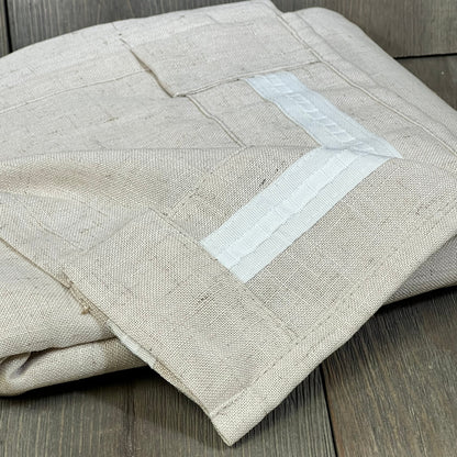 Linen curtains with rod pocket and back tab design, offering a soft, thick texture for light filtering in farmhouse decor.