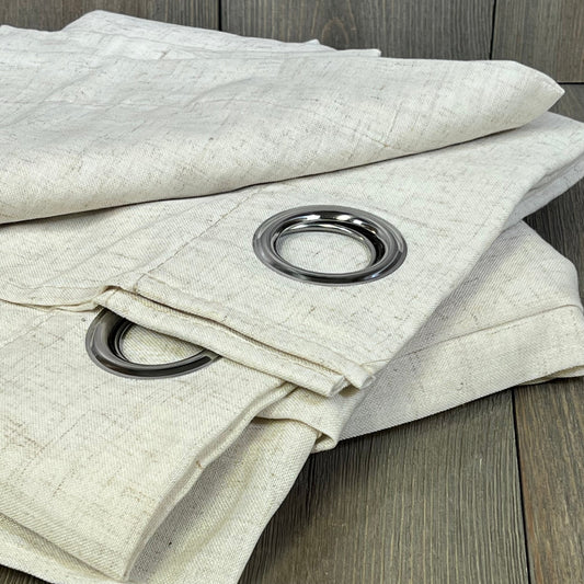 Boho-Chic linen curtains with grommets, semi-sheer for light filtering, natural color, ideal for bedroom or living room decor.