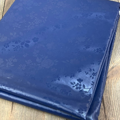 Navy blue Smiry vinyl tablecloth with floral pattern, 60" x 84", waterproof and wipeable for kitchen and dining use.