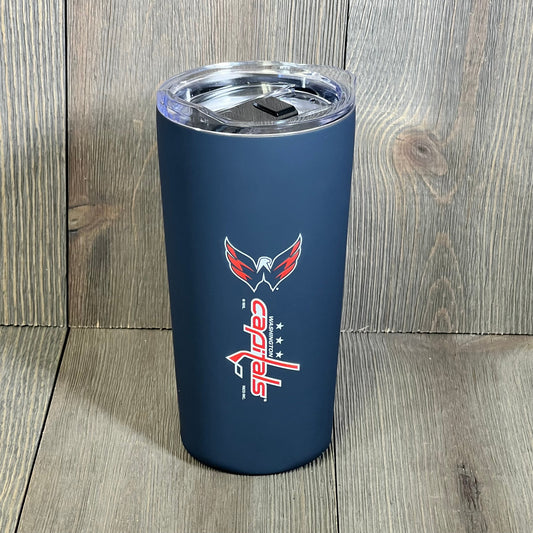 Washington Capitals 18oz tumbler with soft touch finish, featuring easy grip design and vivid team logo on a wooden backdrop.