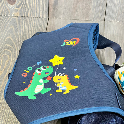 Colorful dinosaur design on safety harness for kids with autism, featuring adjustable straps and light reflector.