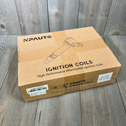 Cardboard box labeled "Ignition Coils" for V8 5.0L Ford F-150 and Mustang, showing aftermarket ignition coil packaging.