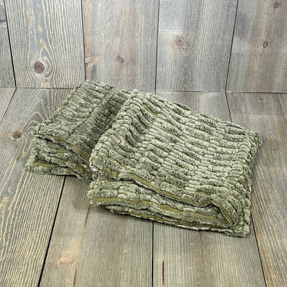 Soft grey corduroy pillow covers with boho stripes for modern farmhouse decor on a rustic wood background.