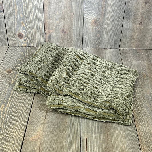 Soft grey corduroy pillow covers with boho stripes for modern farmhouse decor on a rustic wood background.