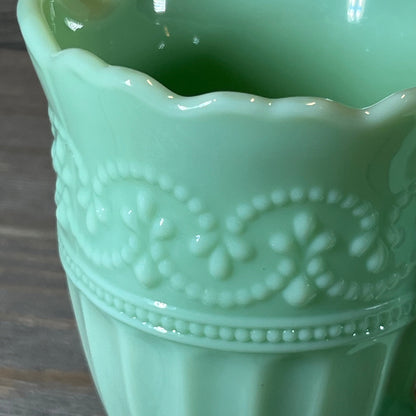 Ornate detailing on The Pioneer Woman Timeless Beauty Jade Creamer in soft green ceramic.