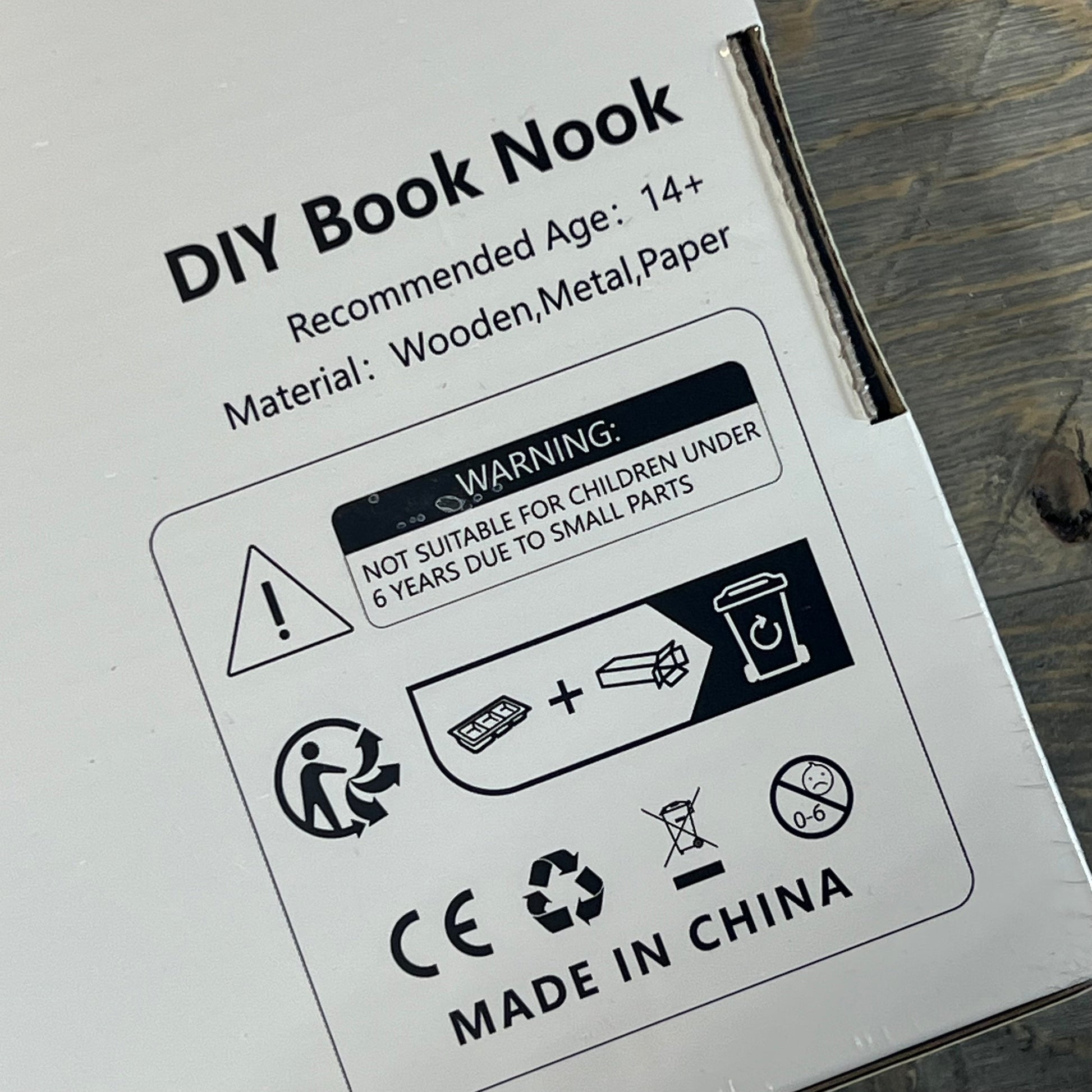Packaging for 1058206412-NEWREACH Book Nook Kit showing material details and safety warnings.