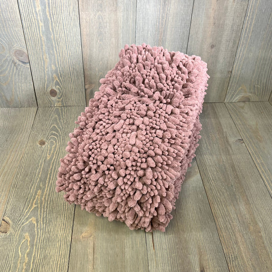 Mauve Yimobra bathroom rug, 44x24 inches, plush and thick, on wooden floor for modern home decor.