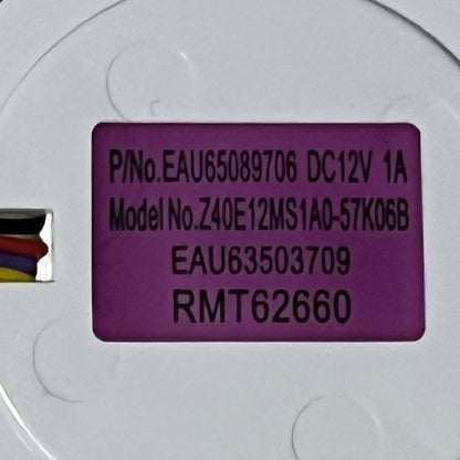 Close-up of LG refrigerator evaporator fan motor model EAU63503709 label with specifications and wiring details.