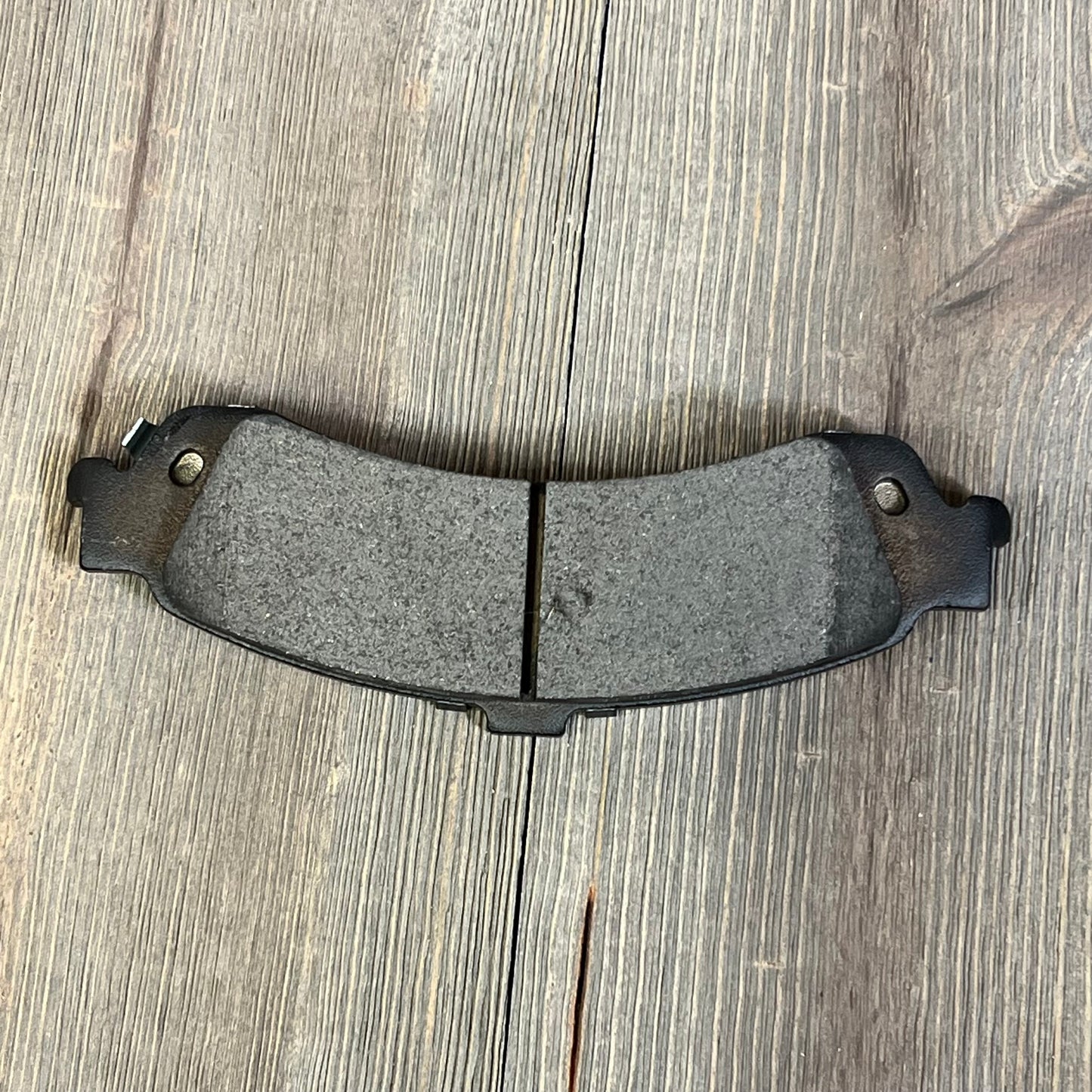 Rear ceramic disc brake pad from ECCPP Brake Pads, ideal for Cadillac, Chevrolet, GMC vehicles, enhances quiet braking.